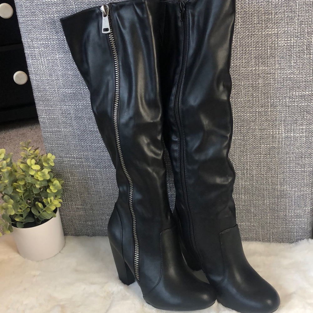 Never worn black knee high boots w/ zipper accent, 4” heel.